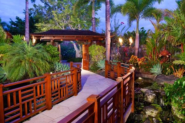 bridge waterfall entrance to kukio home for sale