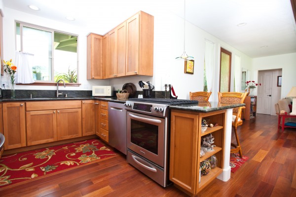 Teak floors, granite counters and vinyl windows/sliders.